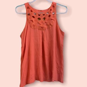 Flowy tank top with lace of design on front and two buttons on neck size medium.